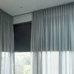 How Do I Hang Curtains Over Vertical Blinds That Stick Out?