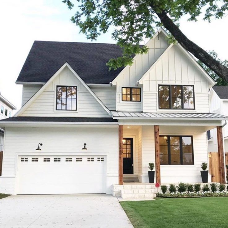 White Wooden House with Black Roof